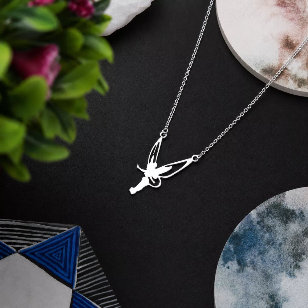 A silver fairy pendant necklace on a delicate silver chain
