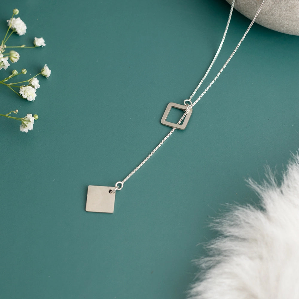 Squaring Off Necklace with sleek squared pendant on a modern chain