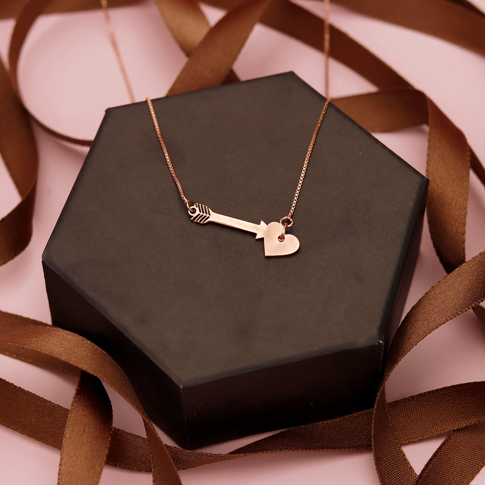 Cupid's Heart and Arrow Necklace with delicate heart and arrow pendant on a fine chain