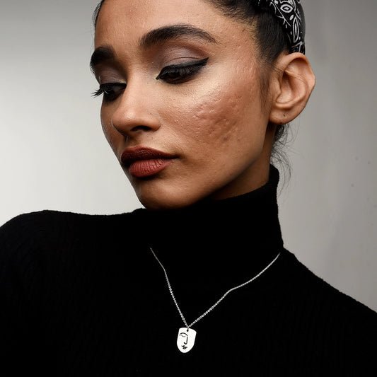 Elevate your style with the Silent Face Necklace. Featuring a sleek, minimalist face pendant, this premium necklace adds a touch of modern elegance to any look. Perfect for everyday wear or special occasions
