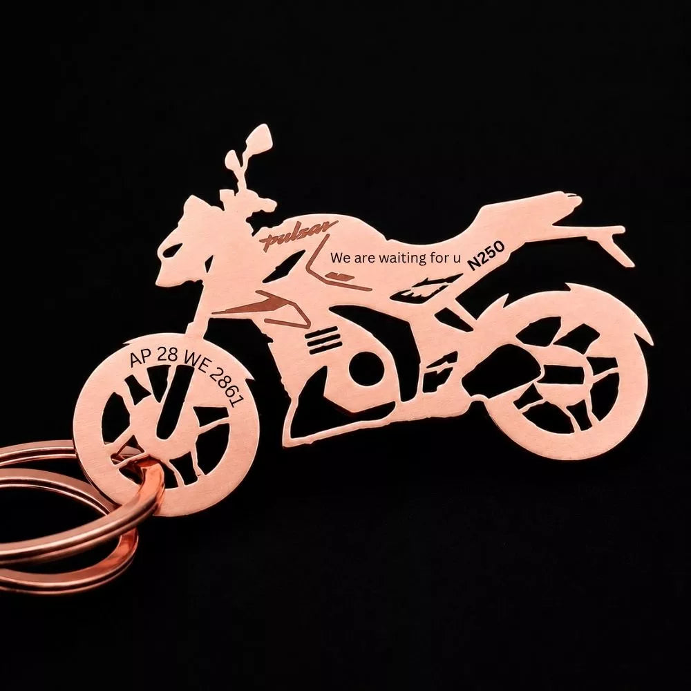 Custom Bajaj Pulsar N250 keychain attached to motorcycle keys, perfect accessory for Pulsar enthusiasts