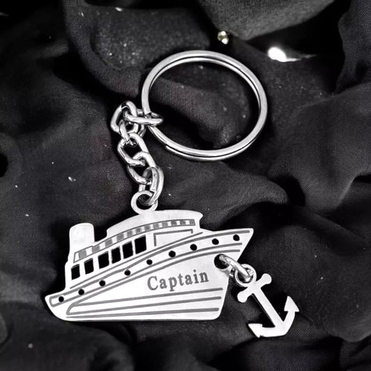 Silver Captain keychain shaped like a ship with anchor charm 